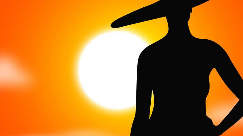Zeichnung: Schatten eines weiblichen Models mit großem Hut vor Sonnenuntergang