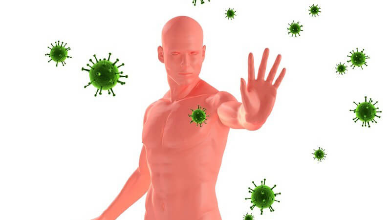 Grafik Immunabwehr - Nackter Mann richtet seine Hand gegen grüne Viren aus der Luft